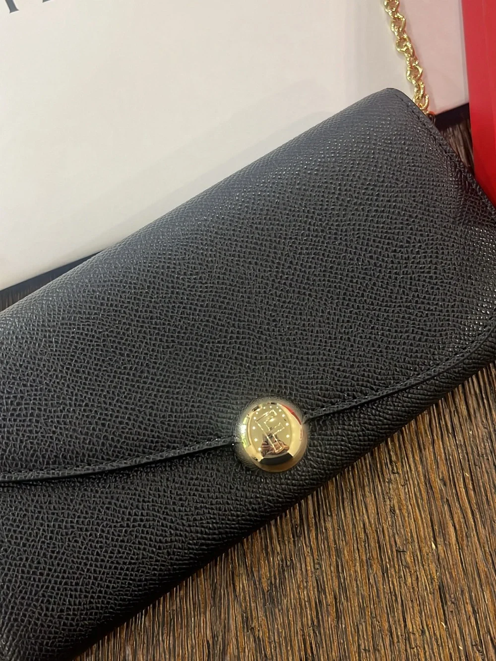 Salvatore Ferragamo Black Leather Clutch with Gold Chain and Button new with tag